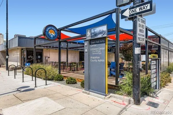 a view of a cafe with sitting area