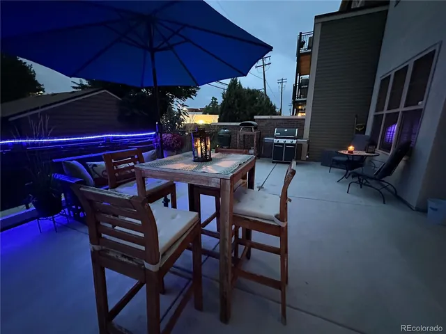 a view of an chairs and table in the patio