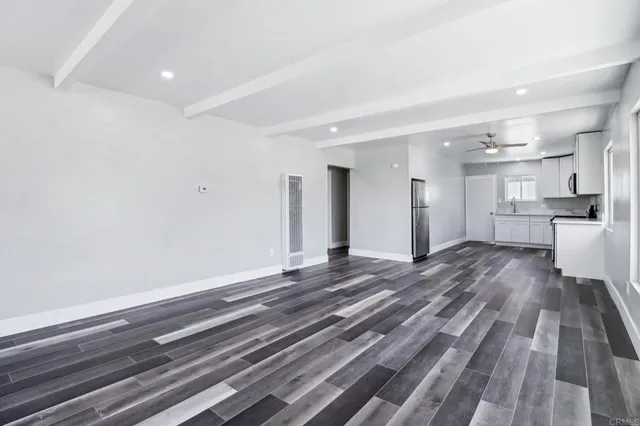 a bathroom with a sink mirror and shower