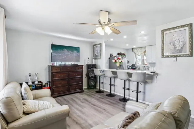 a row of palm trees in front of a house