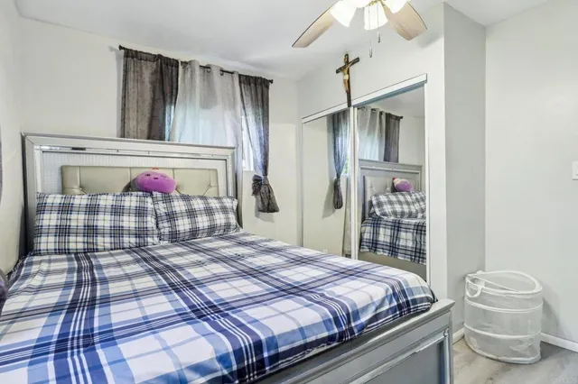 a backyard of a house with barbeque oven and outdoor seating