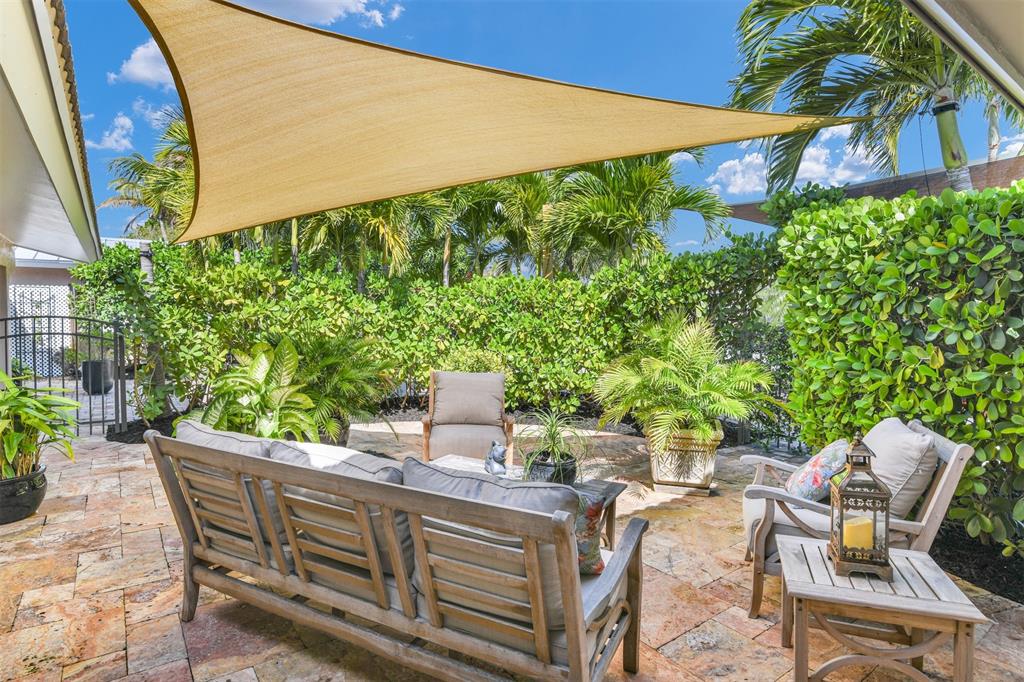 1616 Southeast 4th Street Deerfield Beach, FL 33441 - Photo 18 of 52 a view of a chairs and table in the patio