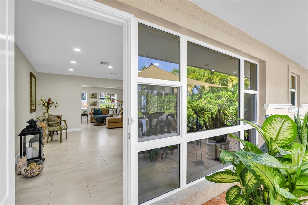 1616 Southeast 4th Street Deerfield Beach, FL 33441 - Photo 20 of 52 a lobby with furniture and a potted plant