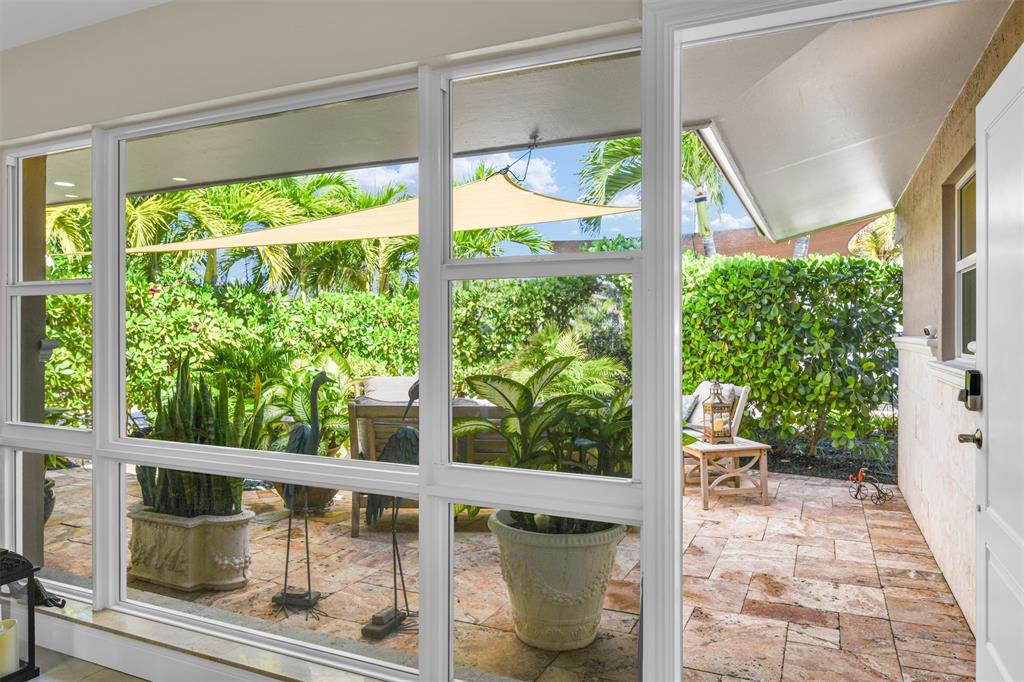 1616 Southeast 4th Street Deerfield Beach, FL 33441 - Photo 22 of 52 a view of a porch with furniture and wooden deck