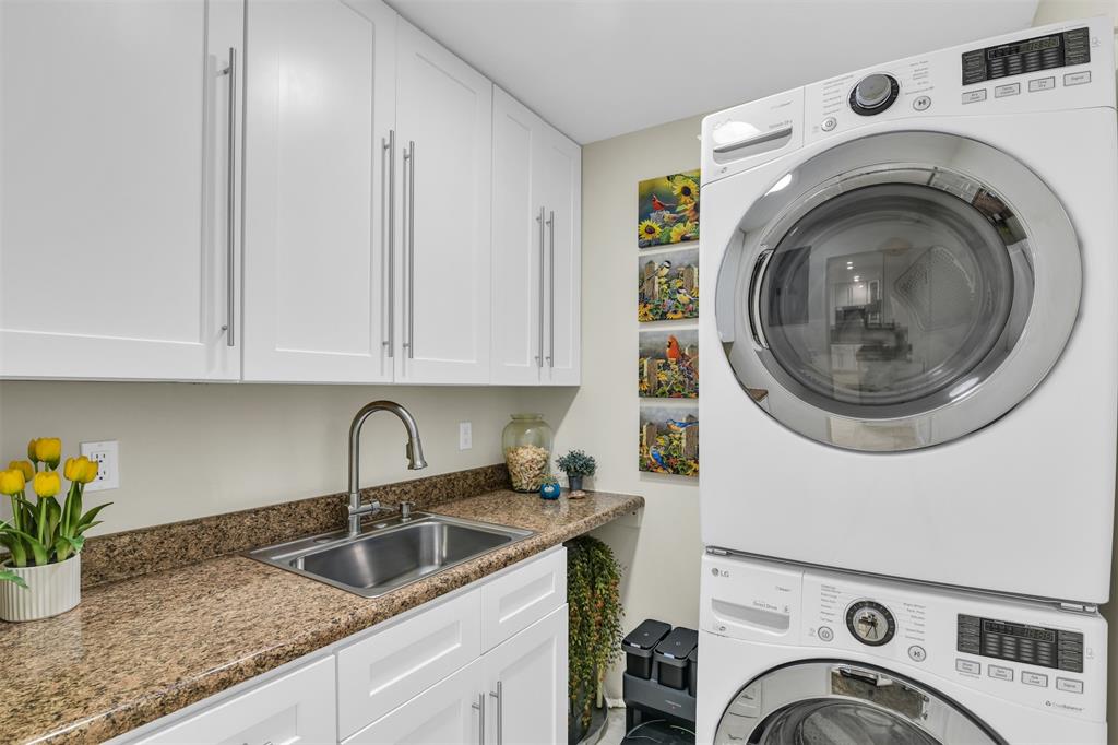 1616 Southeast 4th Street Deerfield Beach, FL 33441 - Photo 27 of 52 a utility room with sink dryer and washer
