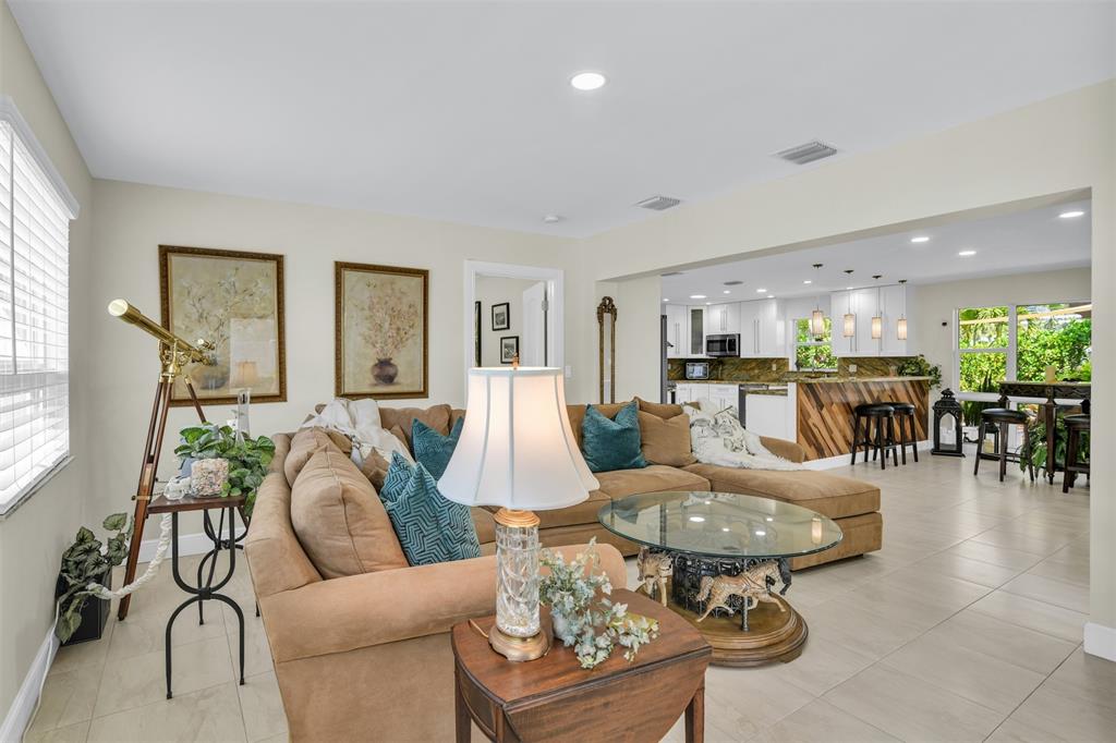 1616 Southeast 4th Street Deerfield Beach, FL 33441 - Photo 30 of 52 a living room with furniture and a table