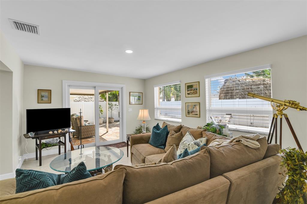 1616 Southeast 4th Street Deerfield Beach, FL 33441 - Photo 31 of 52 a living room with furniture and a flat screen tv