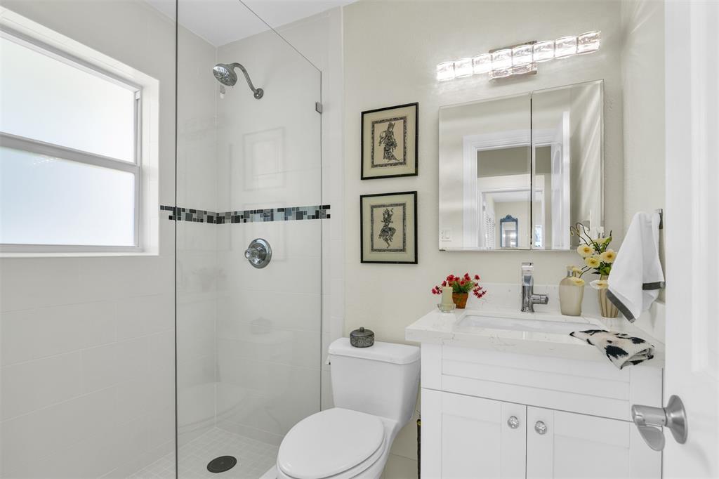 1616 Southeast 4th Street Deerfield Beach, FL 33441 - Photo 32 of 52 a bathroom with a sink toilet and shower