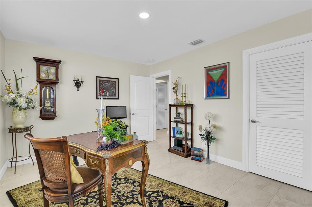 1616 Southeast 4th Street Deerfield Beach, FL 33441 - Photo 34 of 52 a workspace with furniture and window