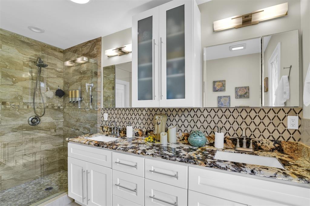 1616 Southeast 4th Street Deerfield Beach, FL 33441 - Photo 37 of 52 a bathroom with a sink and a mirror