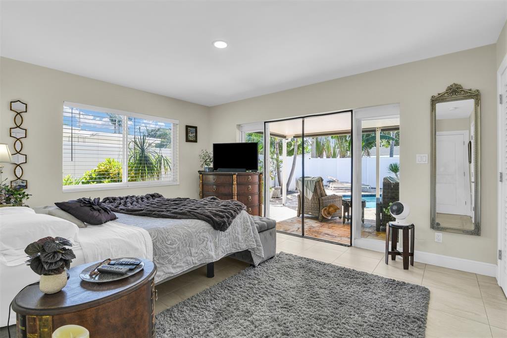 1616 Southeast 4th Street Deerfield Beach, FL 33441 - Photo 38 of 52 a bedroom with a bed and a window with outer view