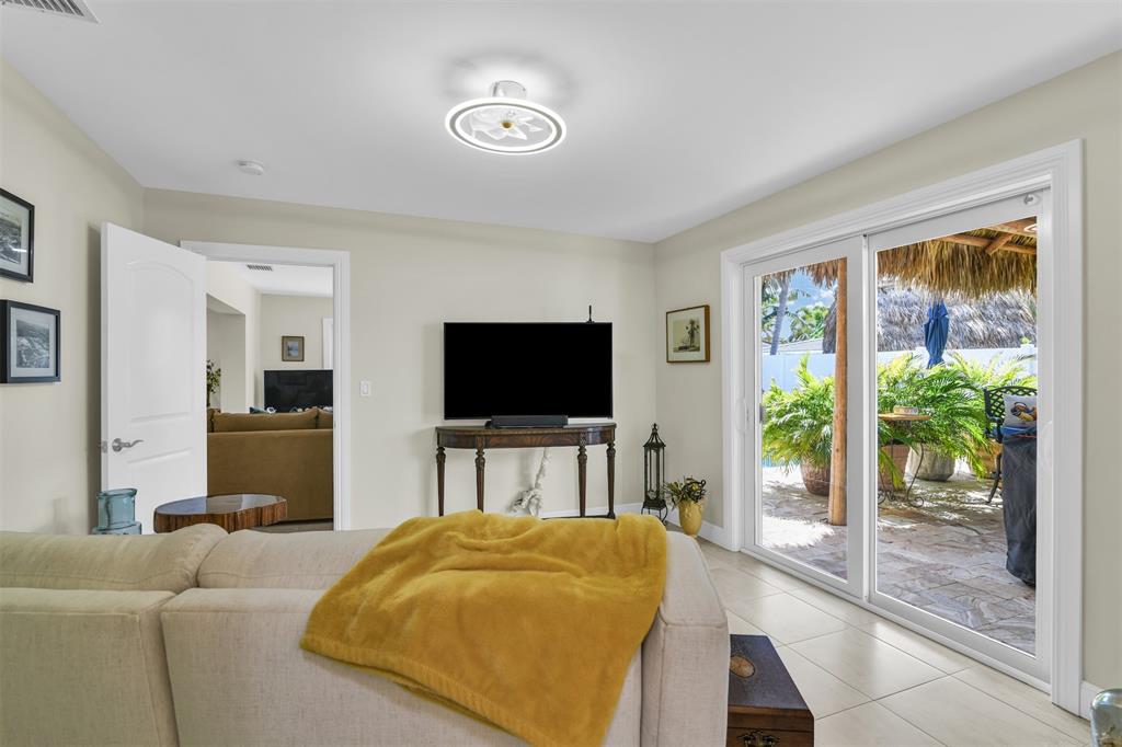 1616 Southeast 4th Street Deerfield Beach, FL 33441 - Photo 43 of 52 a living room with furniture and a flat screen tv