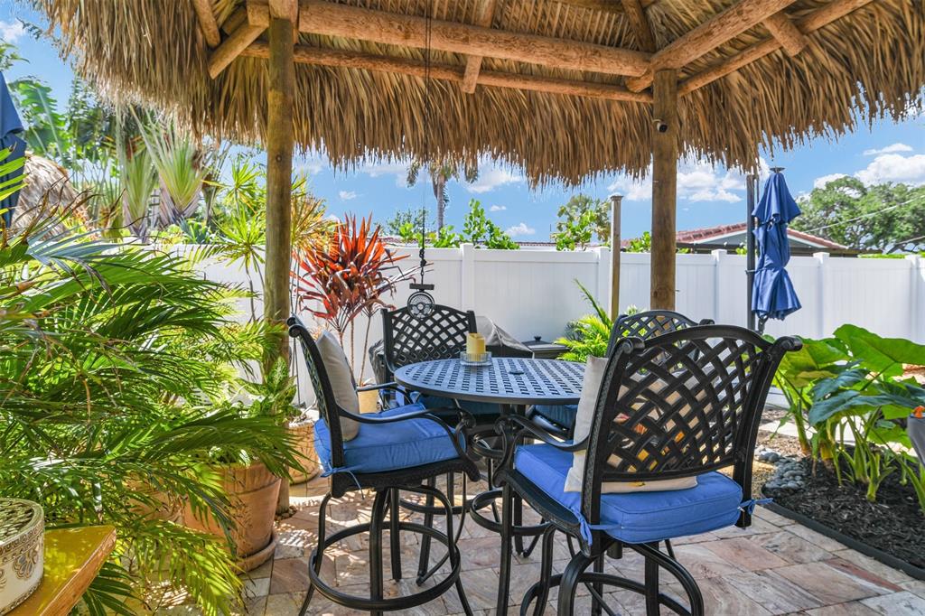 1616 Southeast 4th Street Deerfield Beach, FL 33441 - Photo 47 of 52 a view of a chairs and table in the patio