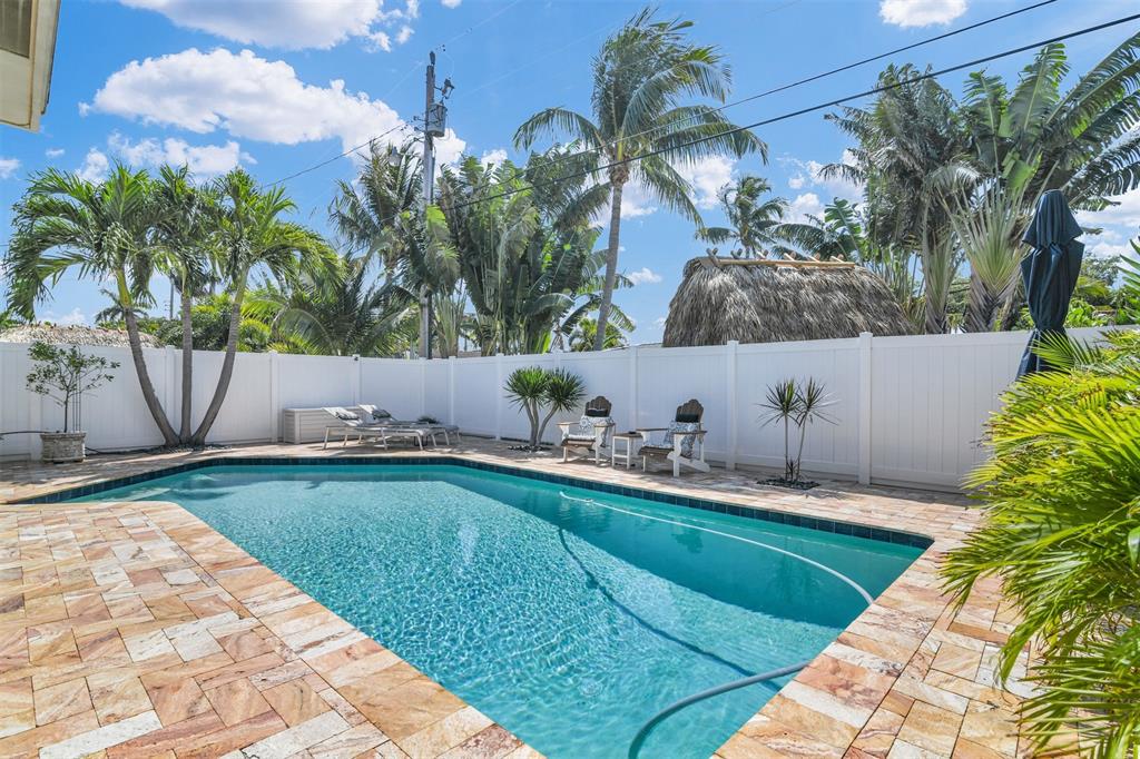 1616 Southeast 4th Street Deerfield Beach, FL 33441 - Photo 48 of 52 a view of backyard with outdoor seating and plants