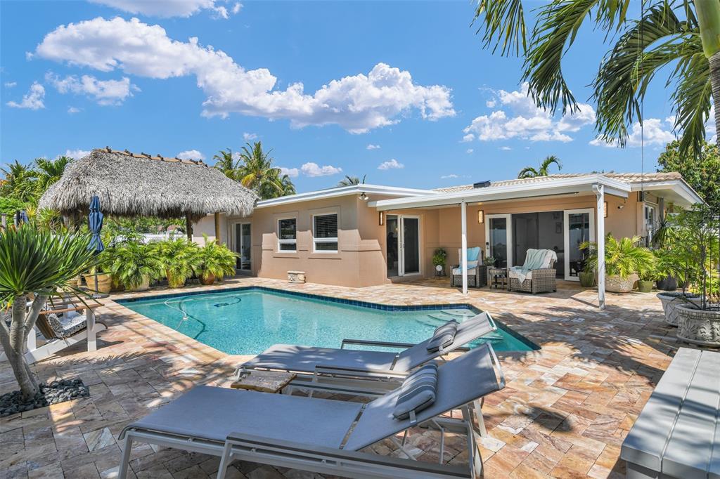 1616 Southeast 4th Street Deerfield Beach, FL 33441 - Photo 51 of 52 a view of a house with swimming pool and sitting area