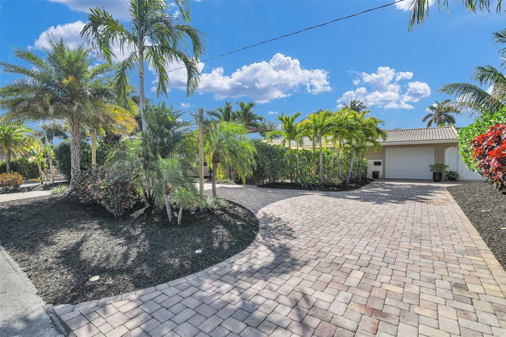 1616 Southeast 4th Street Deerfield Beach, FL 33441 - Photo 9 of 52 a view of a yard with flower plants