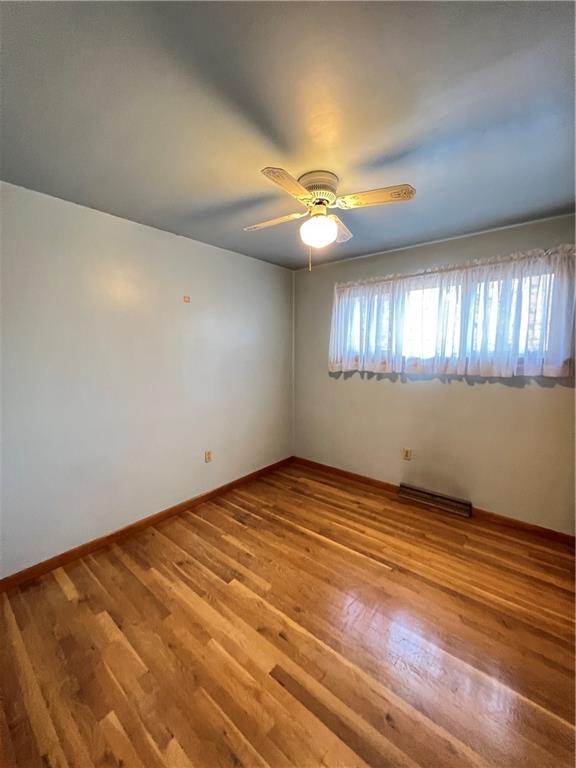 150 Wall Street Rochester, PA 15074 - Photo 14 of 23 an empty room with windows and fan