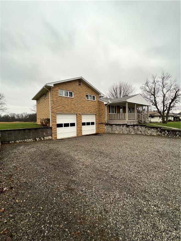 150 Wall Street Rochester, PA 15074 - Photo 2 of 23 a front view of a house with a yard and large tree