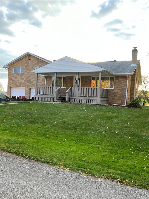 150 Wall Street Rochester, PA 15074 - Photo 3 of 23 a front view of a house with a garden