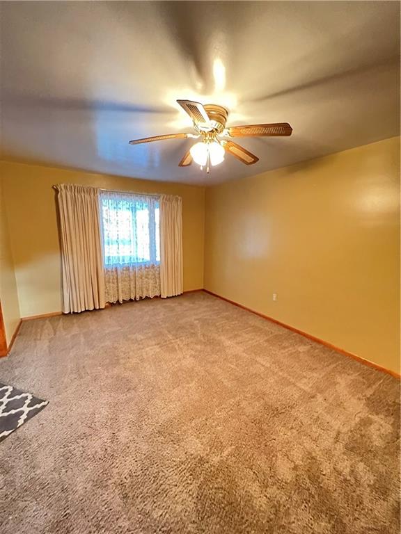 150 Wall Street Rochester, PA 15074 - Photo 5 of 23 an empty room with windows and fan