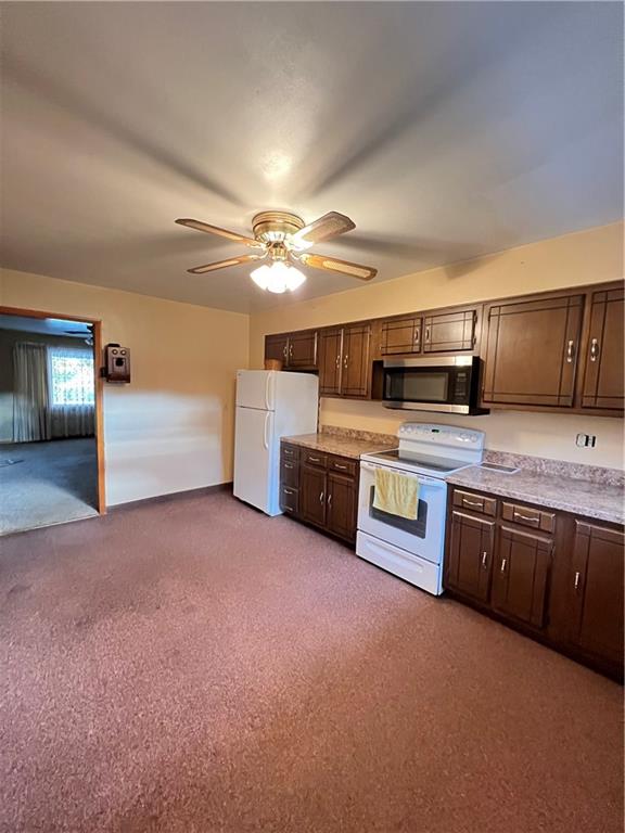 150 Wall Street Rochester, PA 15074 - Photo 8 of 23 a large kitchen with stainless steel appliances and a cabinets