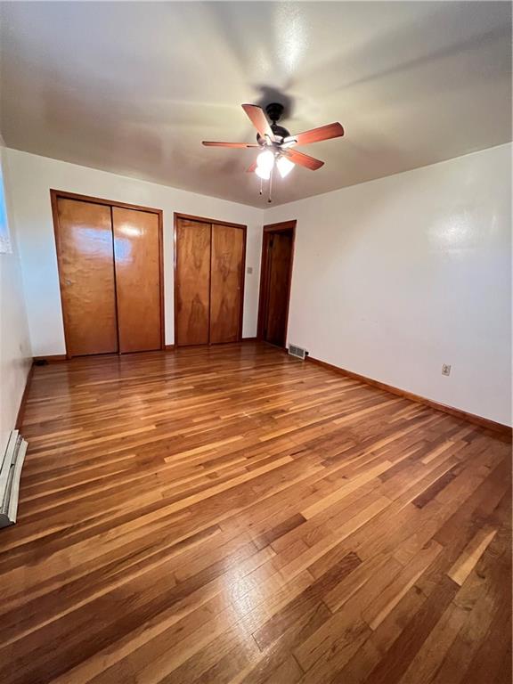 150 Wall Street Rochester, PA 15074 - Photo 10 of 23 a view of an empty room with window and wooden floor