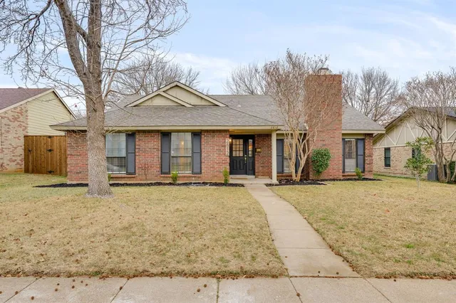front view of a house with a dry yard