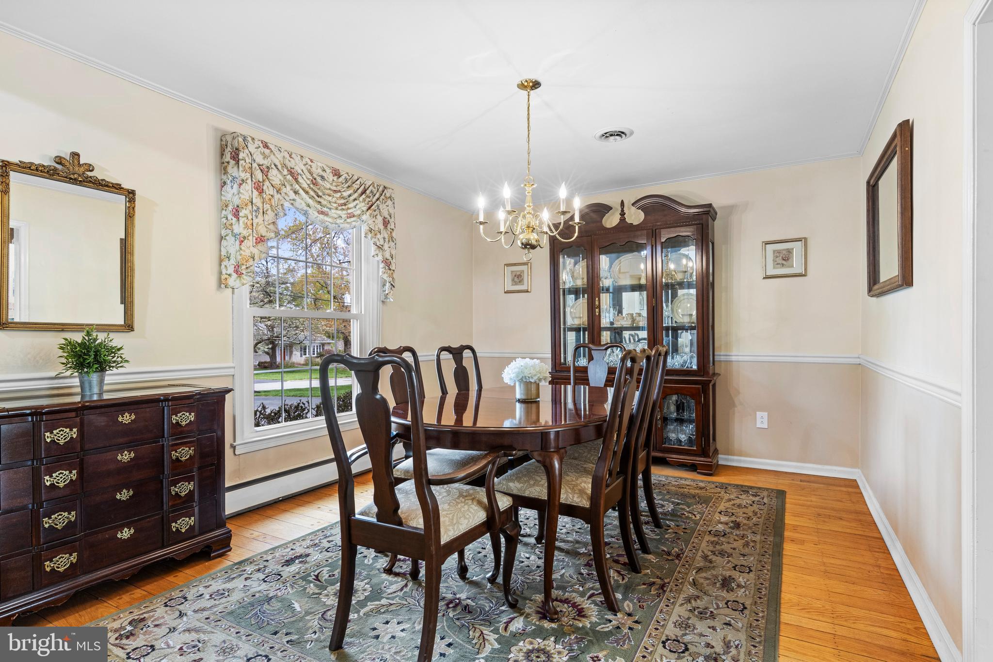 292 Old State Road Berwyn, PA 19312 - Photo 11 of 43 a dining room with furniture a chandelier and wooden floor