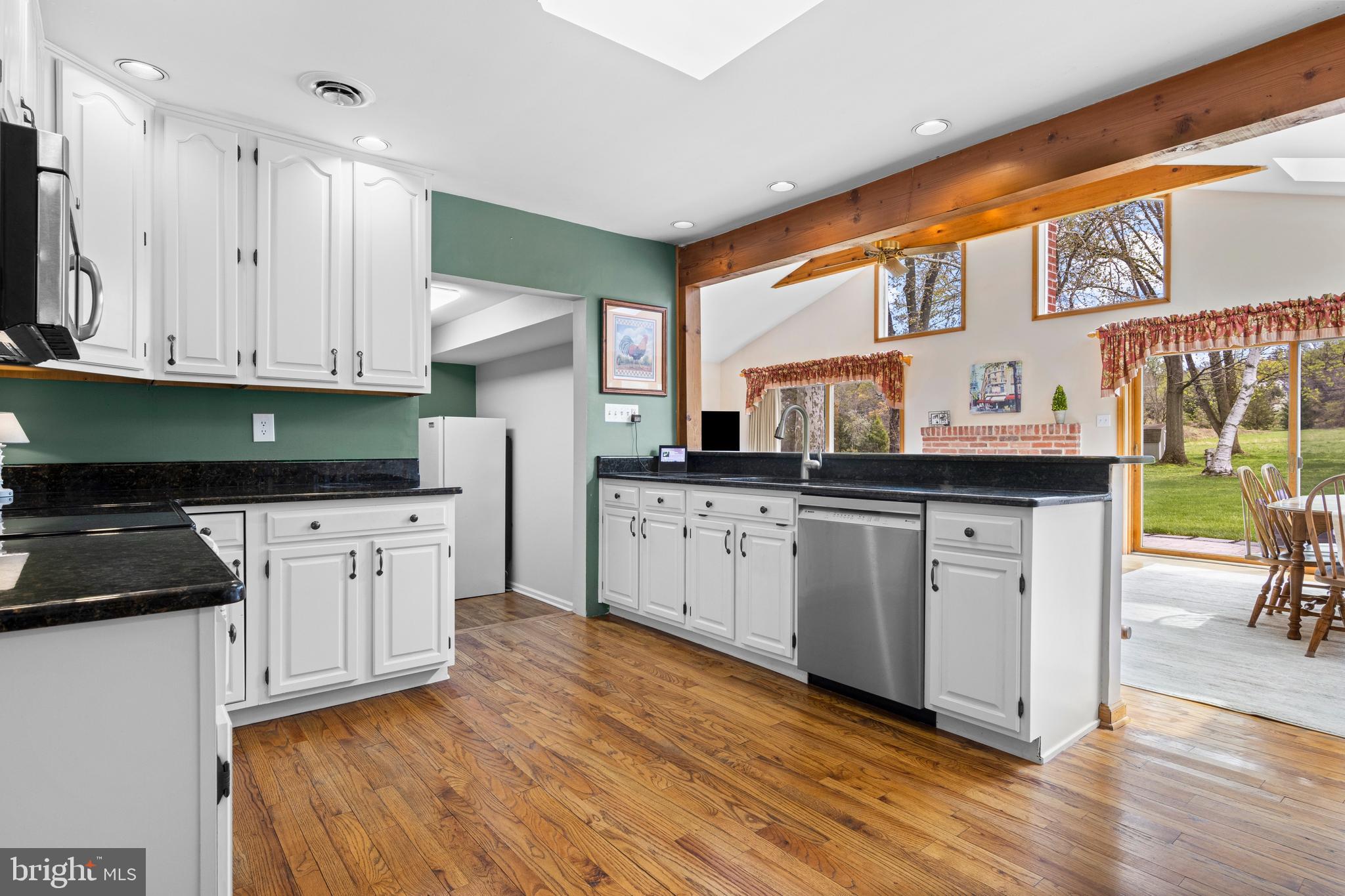 292 Old State Road Berwyn, PA 19312 - Photo 13 of 43 a kitchen with stainless steel appliances granite countertop a stove a sink and a refrigerator