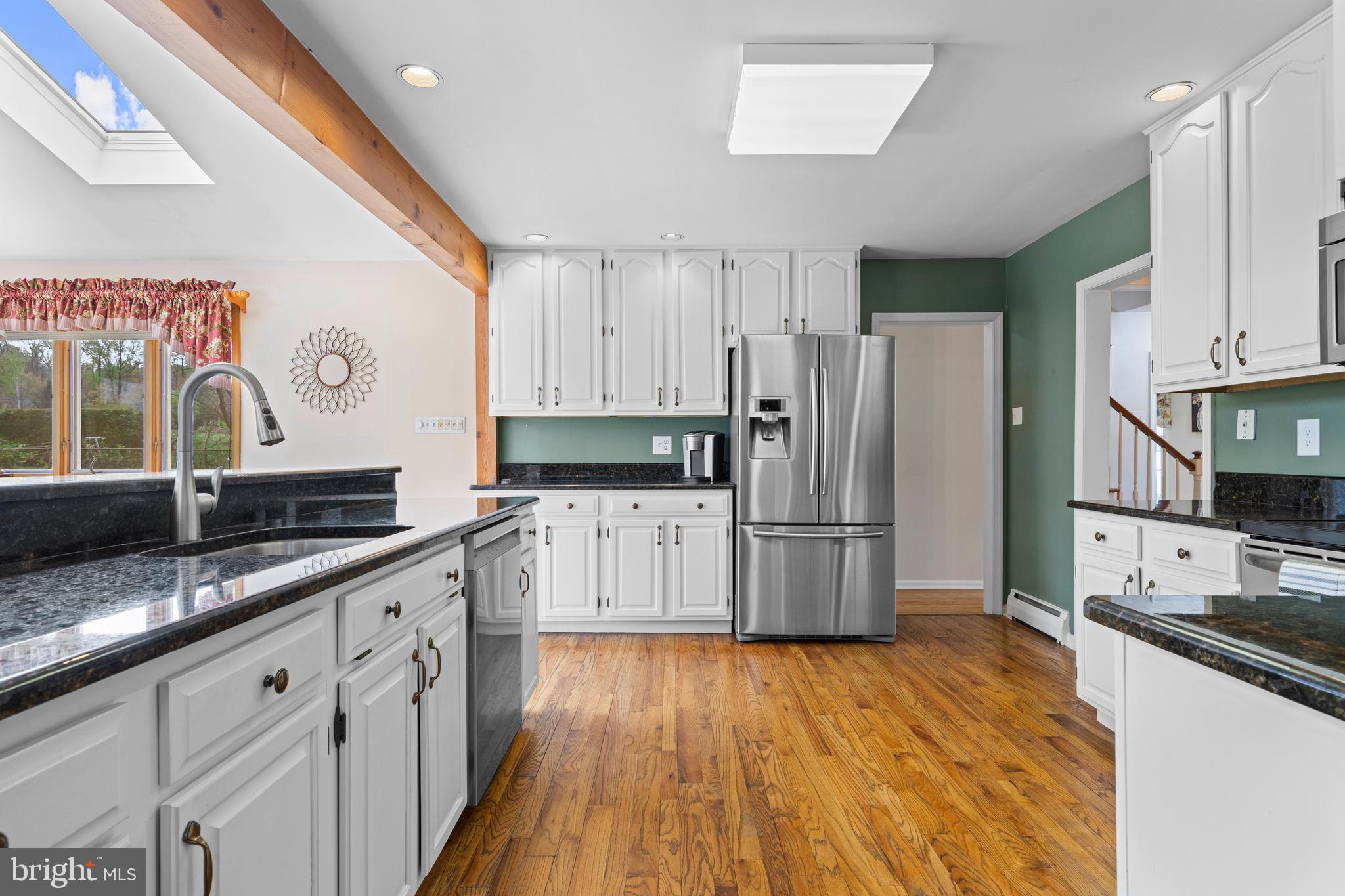 292 Old State Road Berwyn, PA 19312 - Photo 15 of 43 a kitchen with granite countertop a refrigerator stove top oven and sink