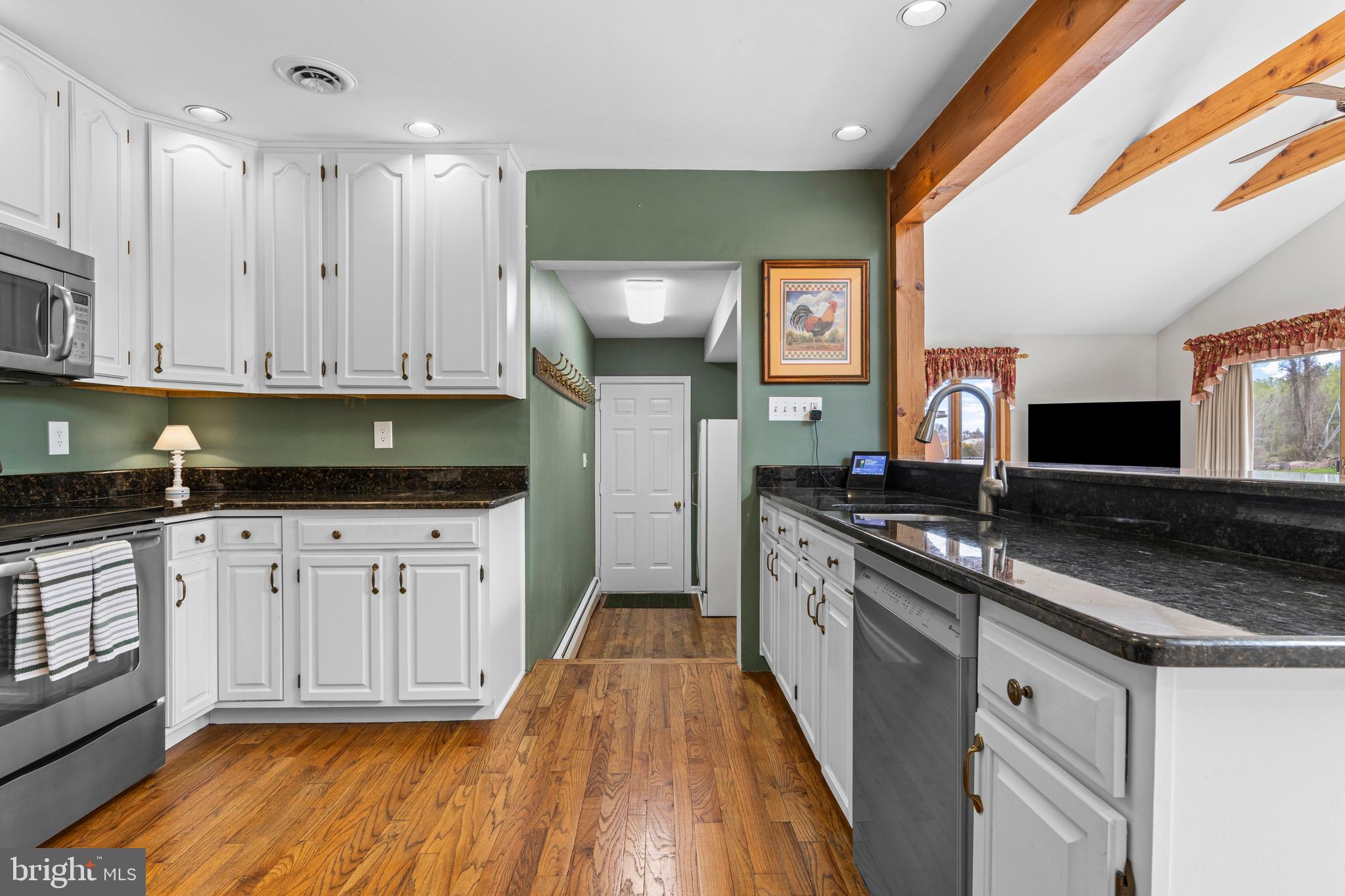 292 Old State Road Berwyn, PA 19312 - Photo 16 of 43 a kitchen with granite countertop a sink stainless steel appliances and cabinets