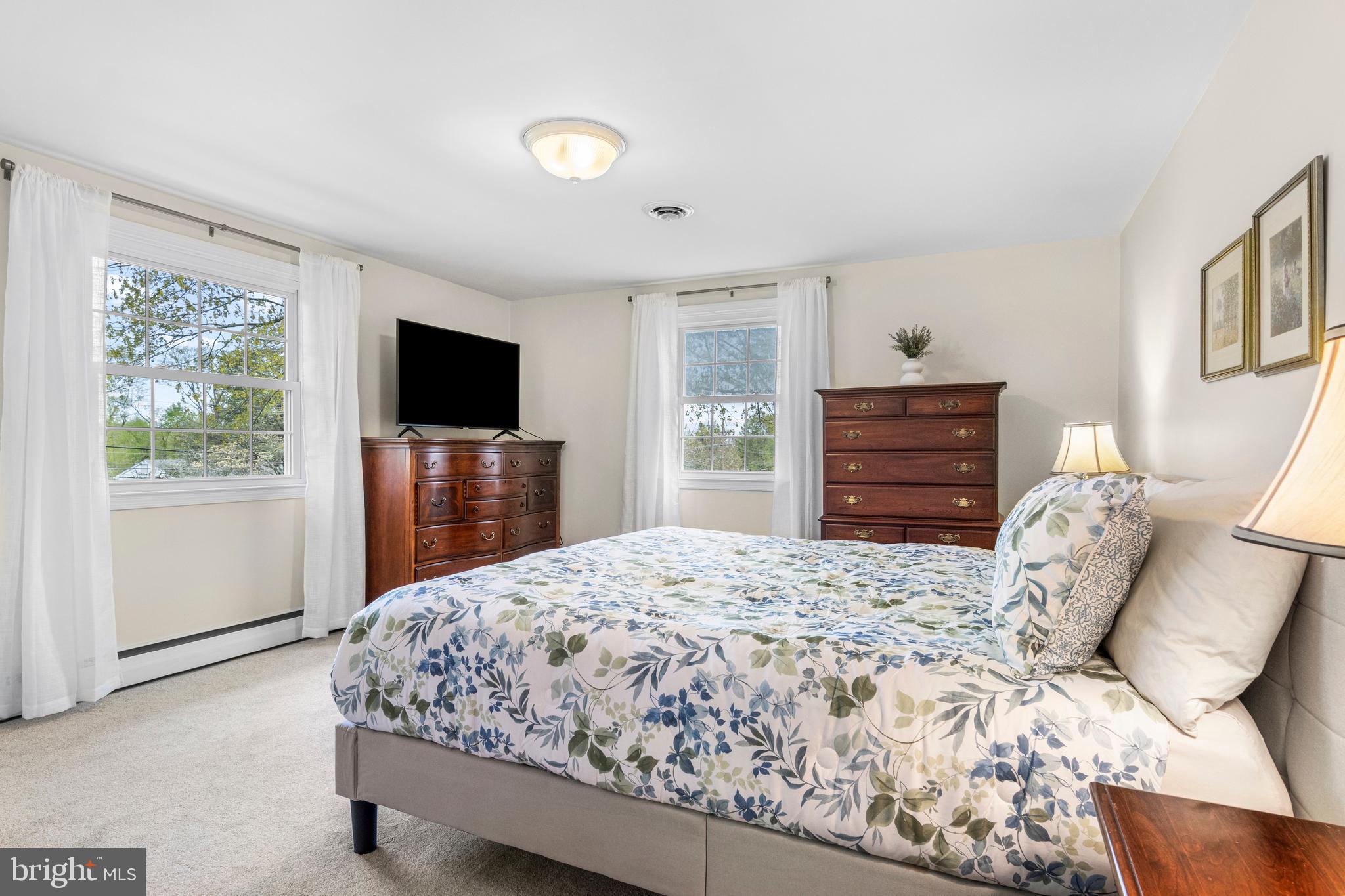 292 Old State Road Berwyn, PA 19312 - Photo 30 of 43 a bedroom with a bed and a flat screen tv