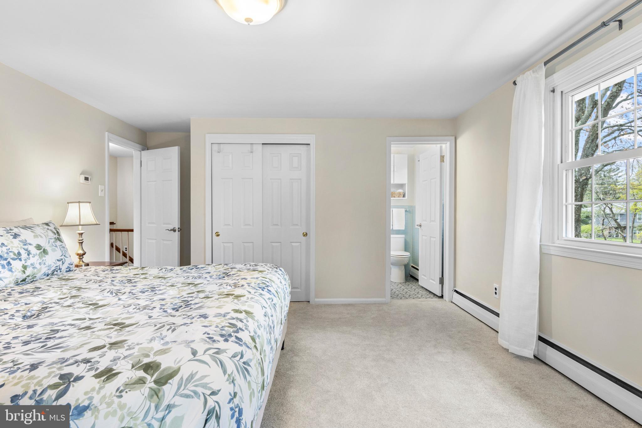 292 Old State Road Berwyn, PA 19312 - Photo 31 of 43 a spacious bedroom with a bed and a window