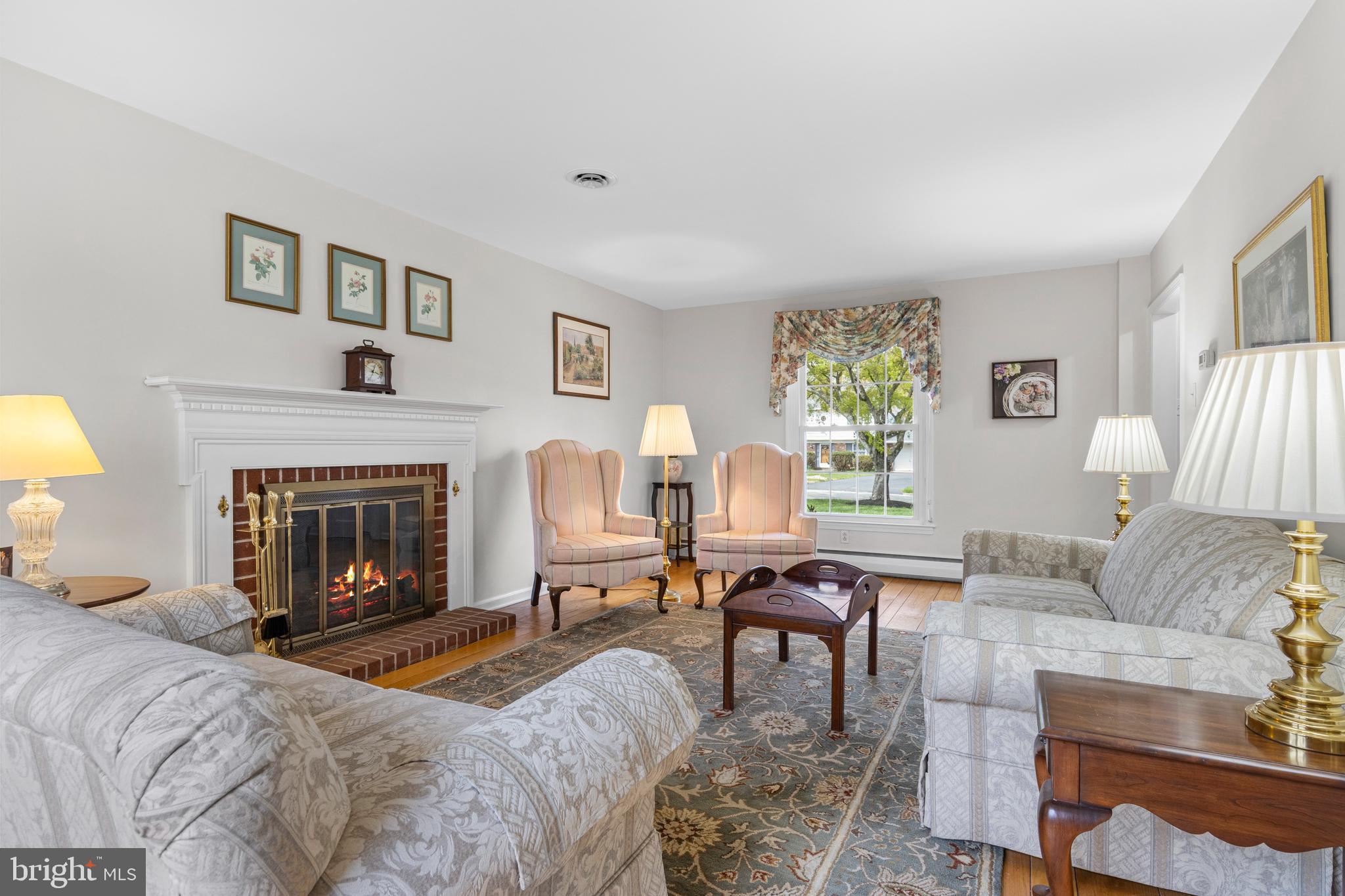 292 Old State Road Berwyn, PA 19312 - Photo 6 of 43 a living room with furniture and a fireplace