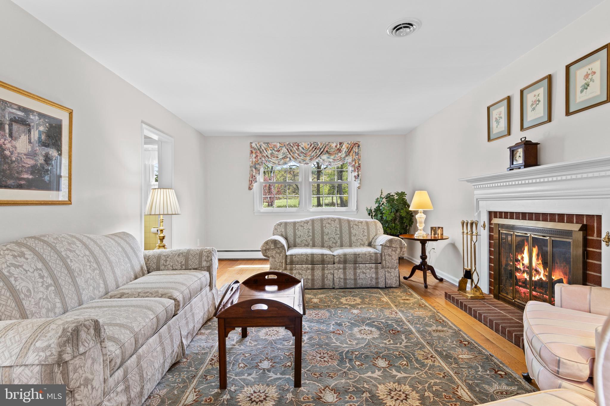 292 Old State Road Berwyn, PA 19312 - Photo 7 of 43 a living room with furniture and a fireplace