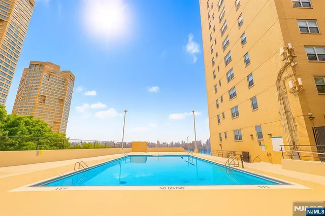 a picture of a swimming pool with a balcony