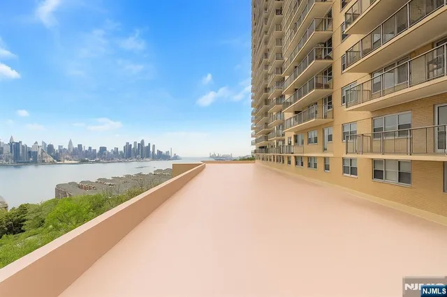 a view of swimming pool with outdoor space and lake view