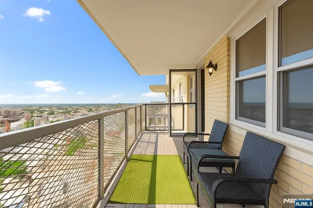 a view of balcony with furniture