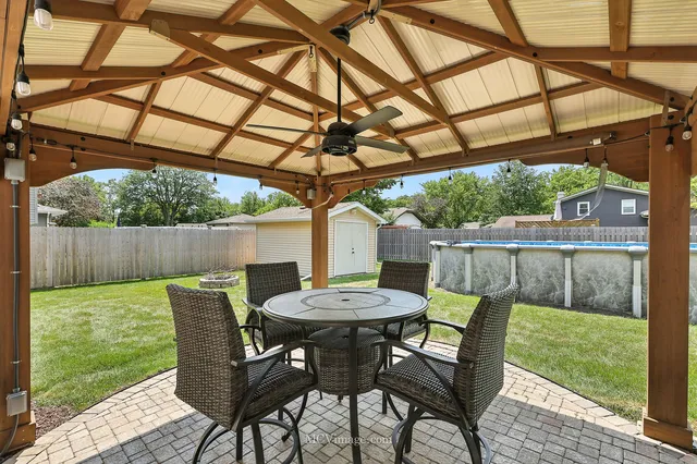 a view of a chairs and table in the patio
