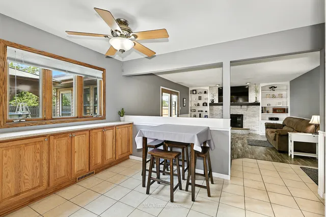 a dining room with furniture and window