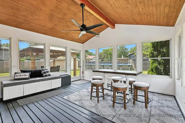 a large white kitchen with a large window
