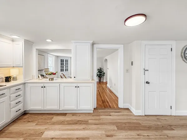 a spacious bathroom with a sink and a mirror
