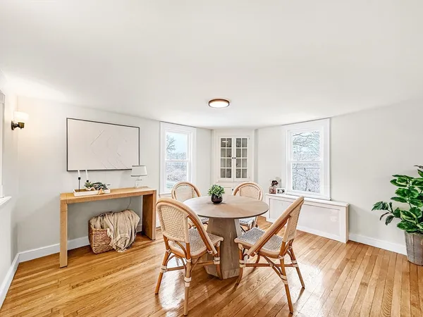 a view of a dining room with furniture and wooden floor