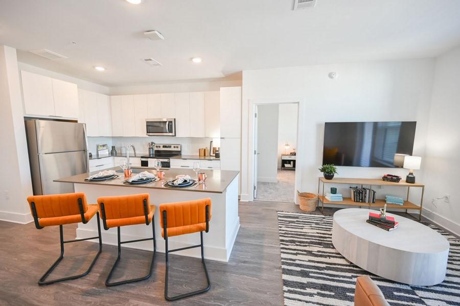 72 Milton Avenue Southeast, Unit 3407 Atlanta, GA 30315 - Photo 5 of 27 a living room with furniture and a flat screen tv