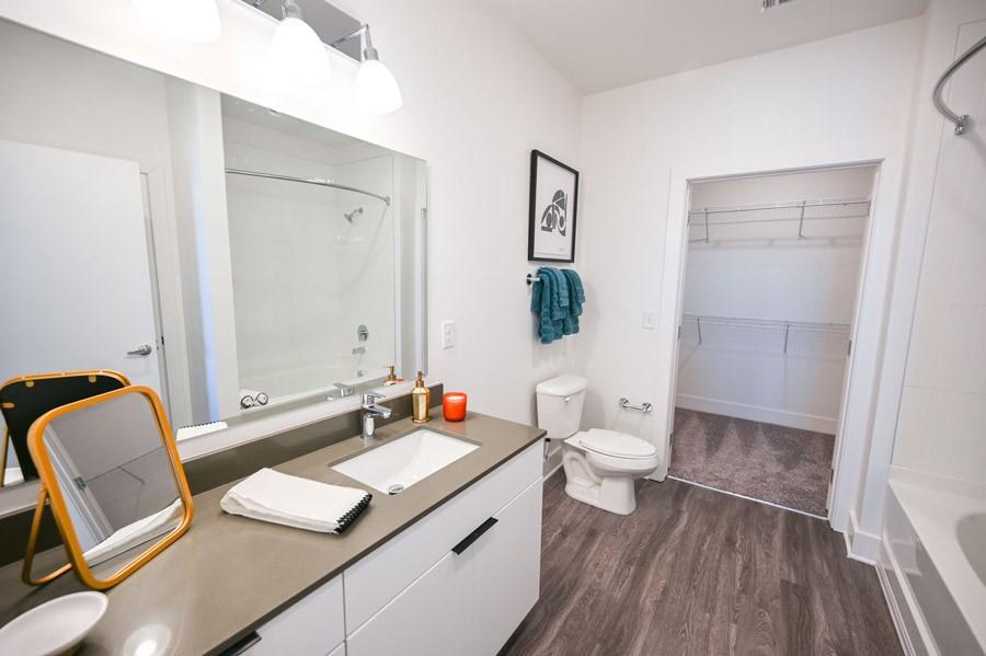 72 Milton Avenue Southeast, Unit 3407 Atlanta, GA 30315 - Photo 10 of 27 a bathroom with a granite countertop sink toilet and shower