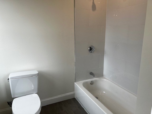 1 Pleasant Street, Unit 206 Cohasset, MA 02025 - Photo 8 of 11 a bathroom with a toilet and bathtub