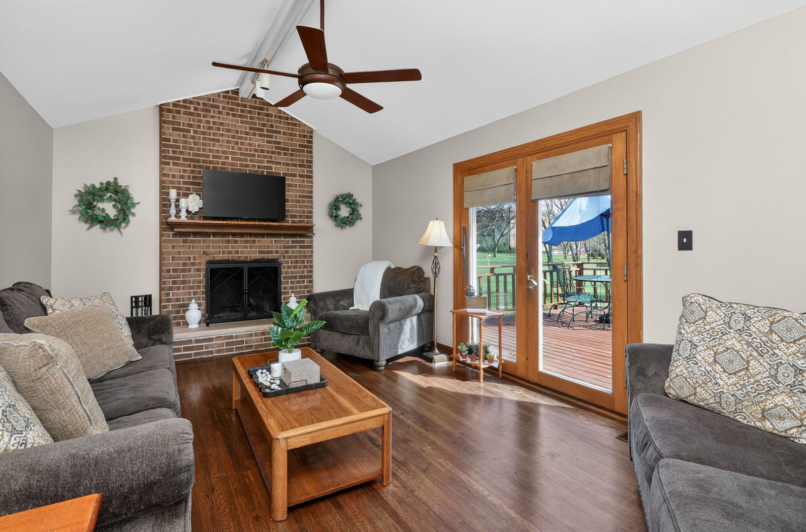 2123 Green Valley Road Darien, IL 60561 - Photo 11 of 30 a living room with furniture fireplace and flat screen tv
