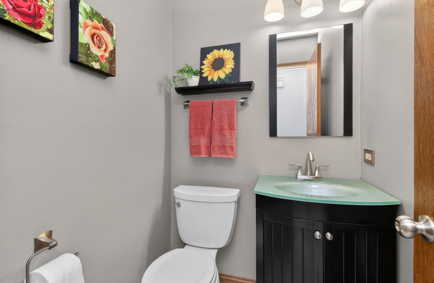 2123 Green Valley Road Darien, IL 60561 - Photo 13 of 30 a bathroom with a toilet sink and mirror