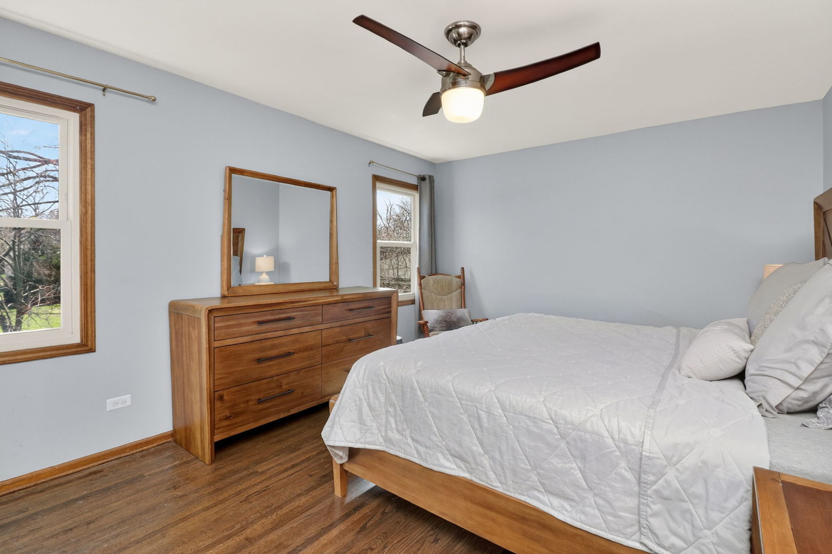 2123 Green Valley Road Darien, IL 60561 - Photo 14 of 30 a bedroom with a bed chandelier and a window