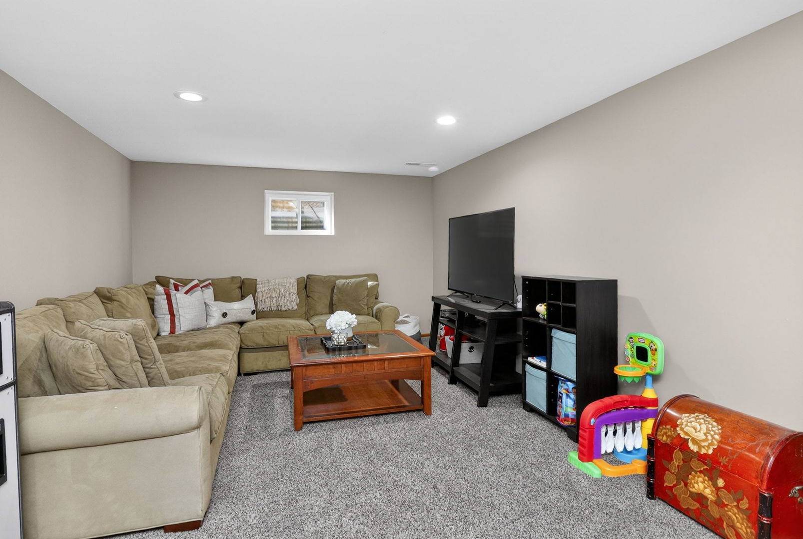 2123 Green Valley Road Darien, IL 60561 - Photo 20 of 30 a living room with furniture and a flat screen tv